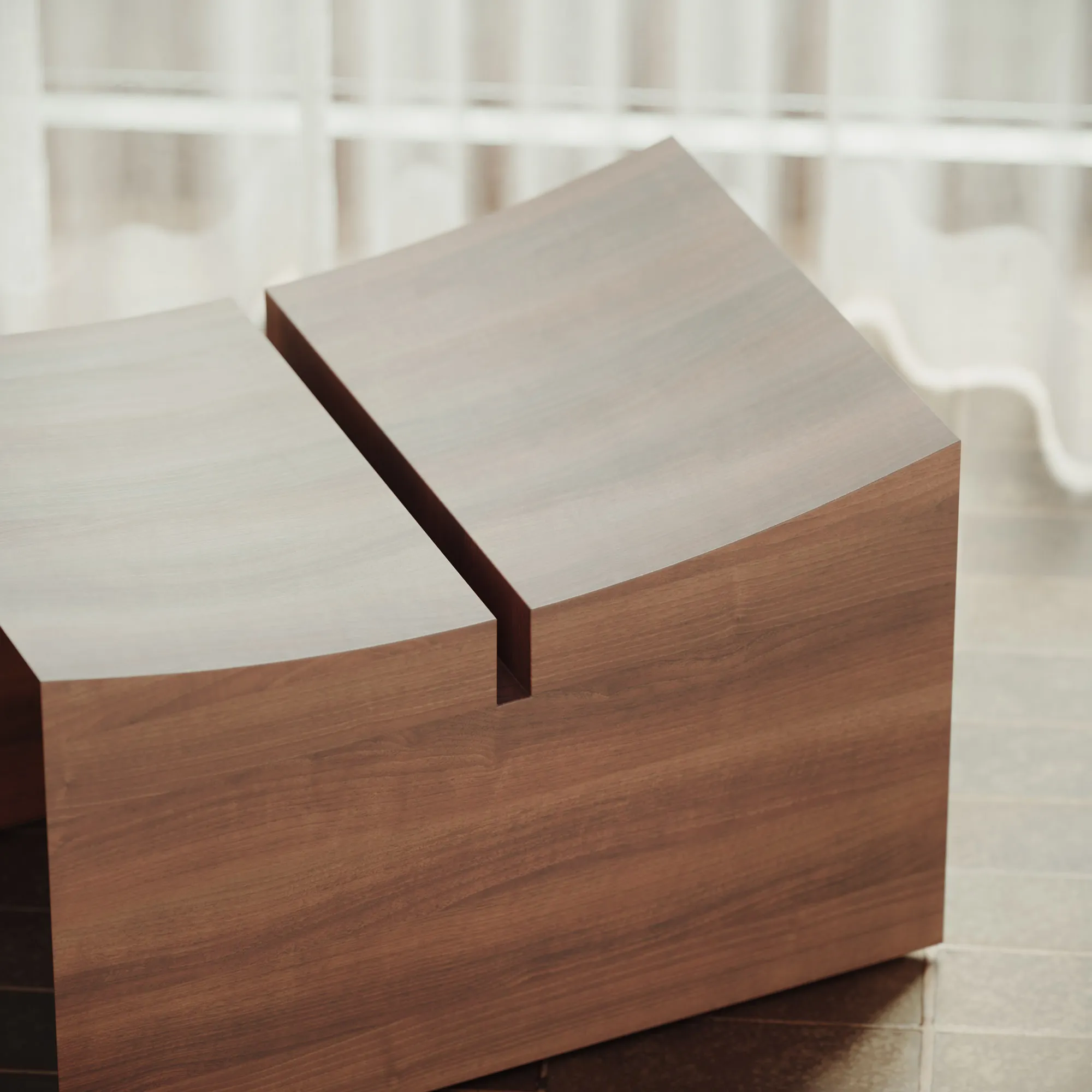 Close view of the Élysée stool's curved satin walnut seat