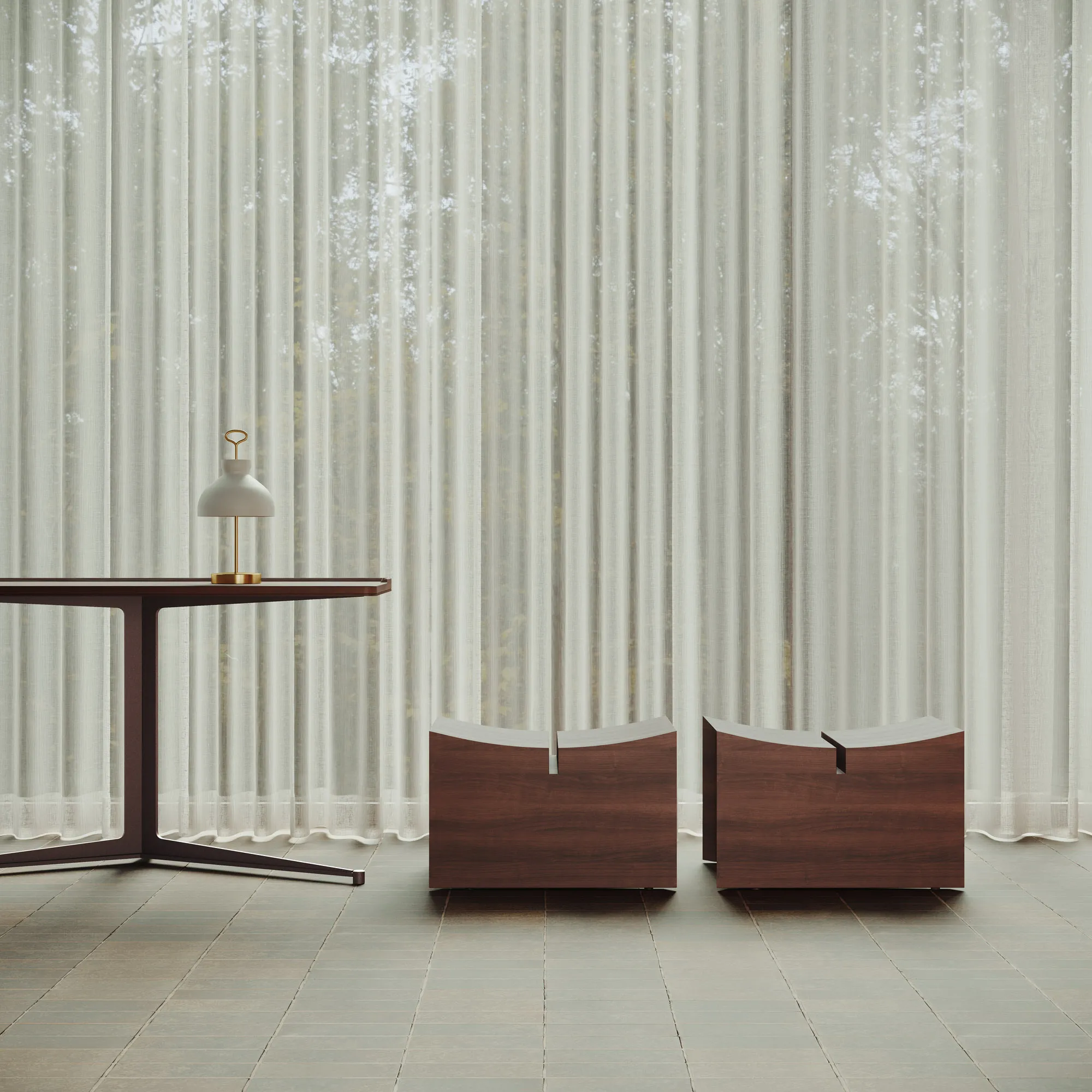 Pair of Élysée low stools with a Pupitre desk in a softly lit interior